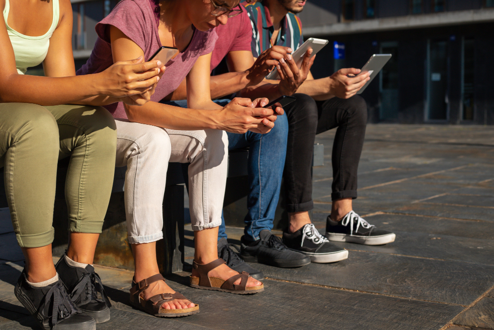 People using their phones to highlight mobile engagement.